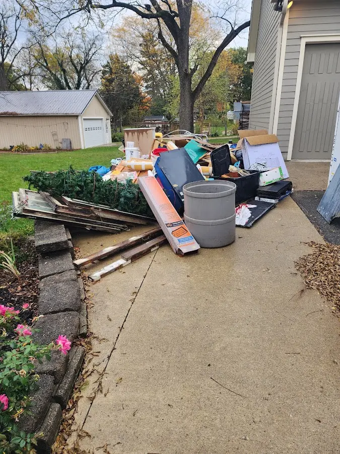 Dumpster being loaded with debris for Commercial Dumpster Rental in Raleigh